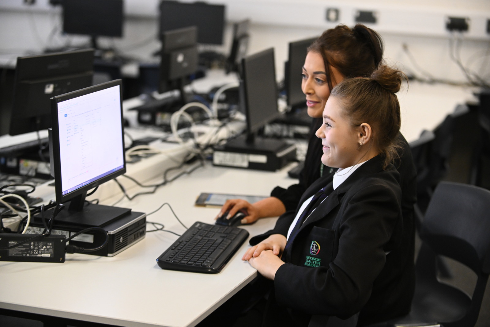 GSA teacher and pupil with computer